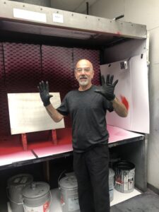 Man wearing safety goggles and gloves